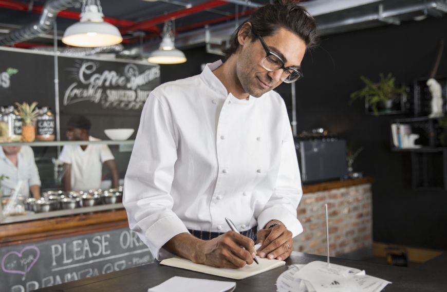 chef writing in note book